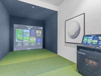 Golf simulator room and outdoor putting green